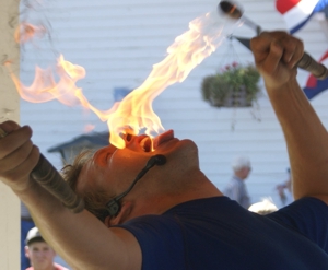 Paul Isaak eating Fire During a State Fair Show